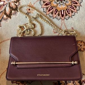 Maroon Strathberry Handbag. Small scratch in upper right corner